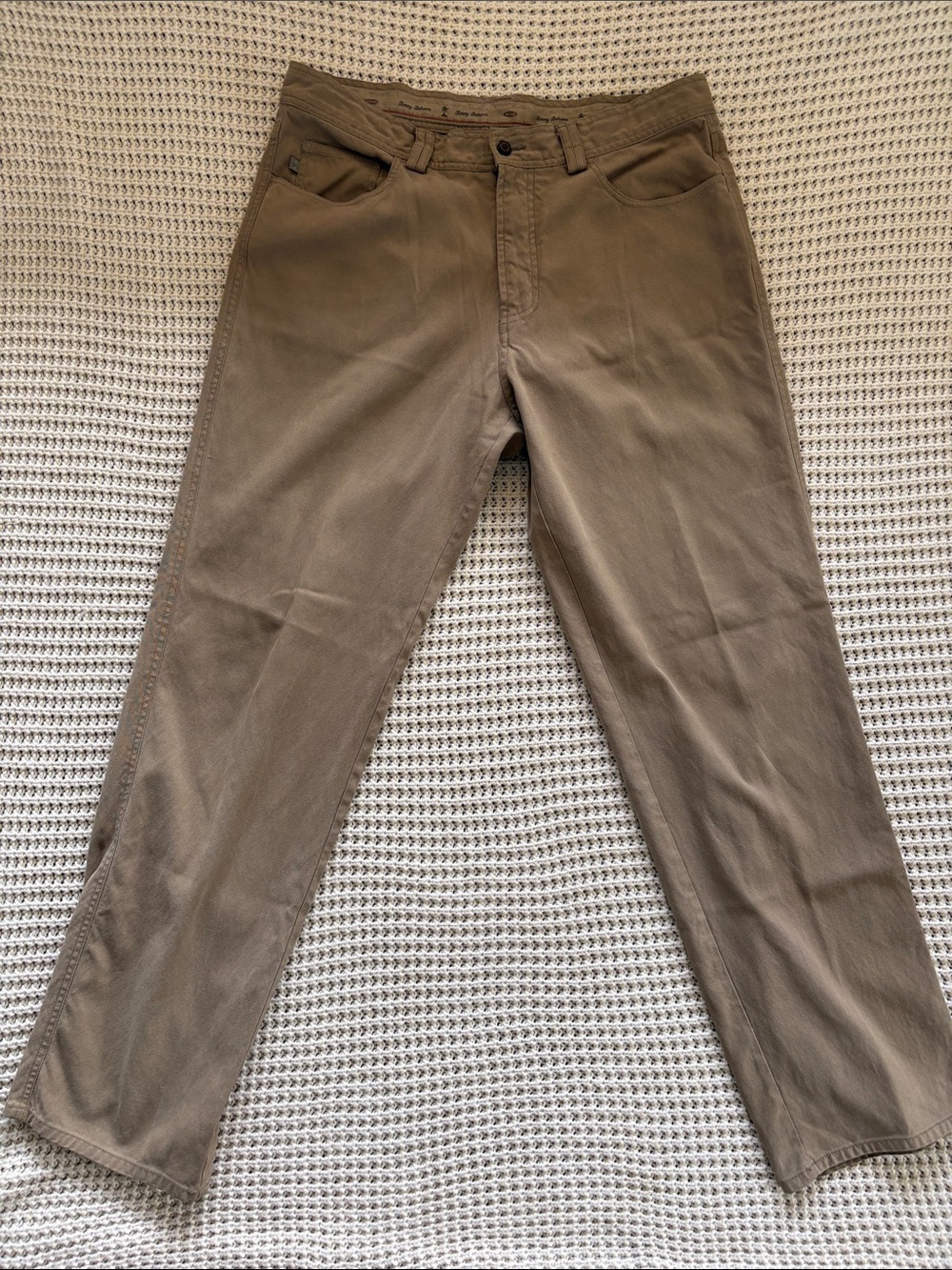 70% Silk 30% cotton 
Tommy Bahama Men's 5 pocket Khaki Straight Chinos - Taupe